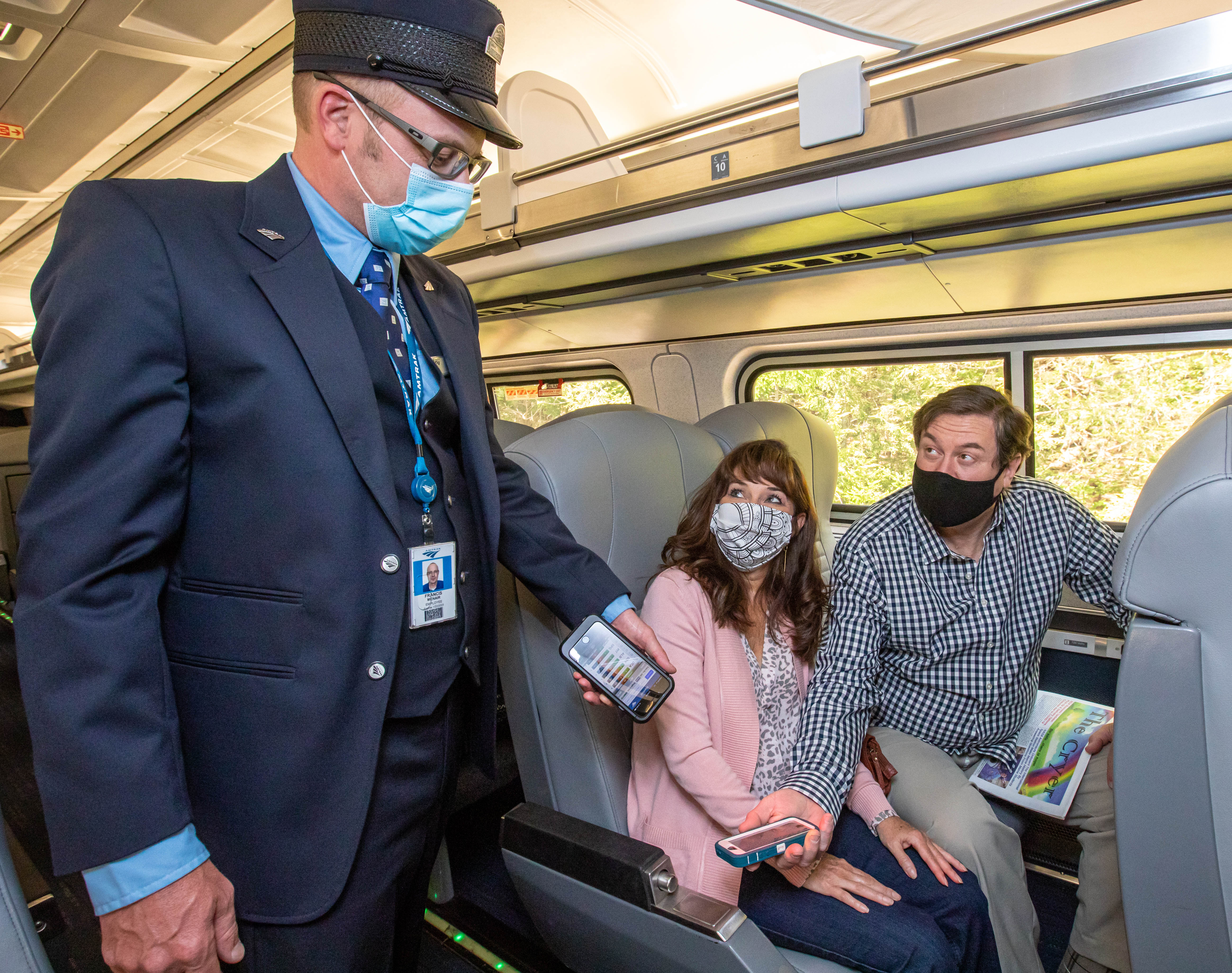 Amtrak Social Distancing Couple onboard with Conductor Masks1 